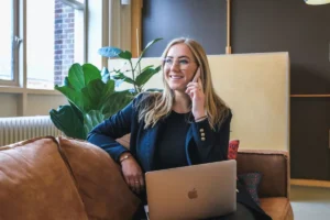 woman on the phone to represent scheduling a call with a religious trauma therapist